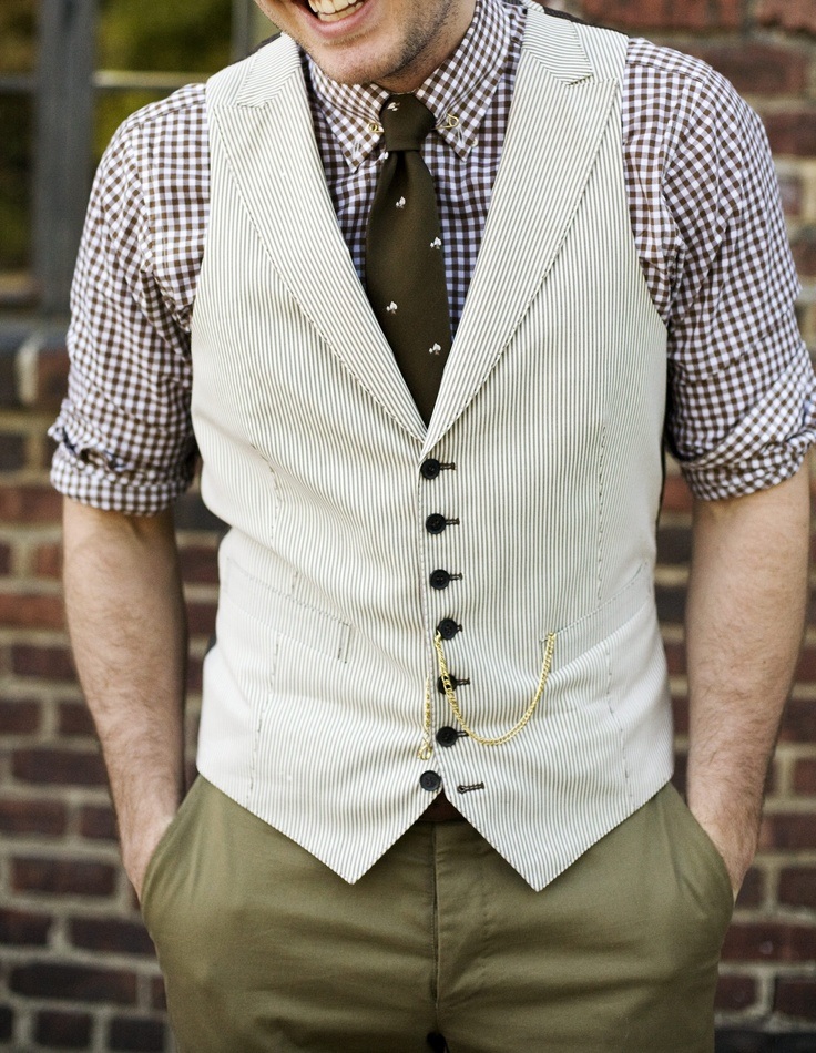 A delightfully dandy combination of checks, a waistcoat and a watch chain.