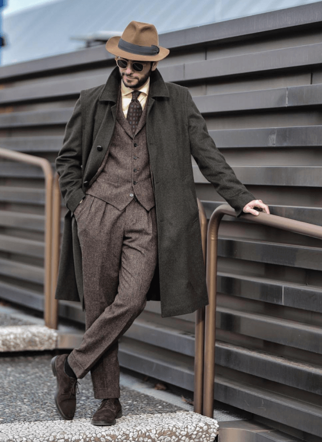 fedora hat, long coat and suit