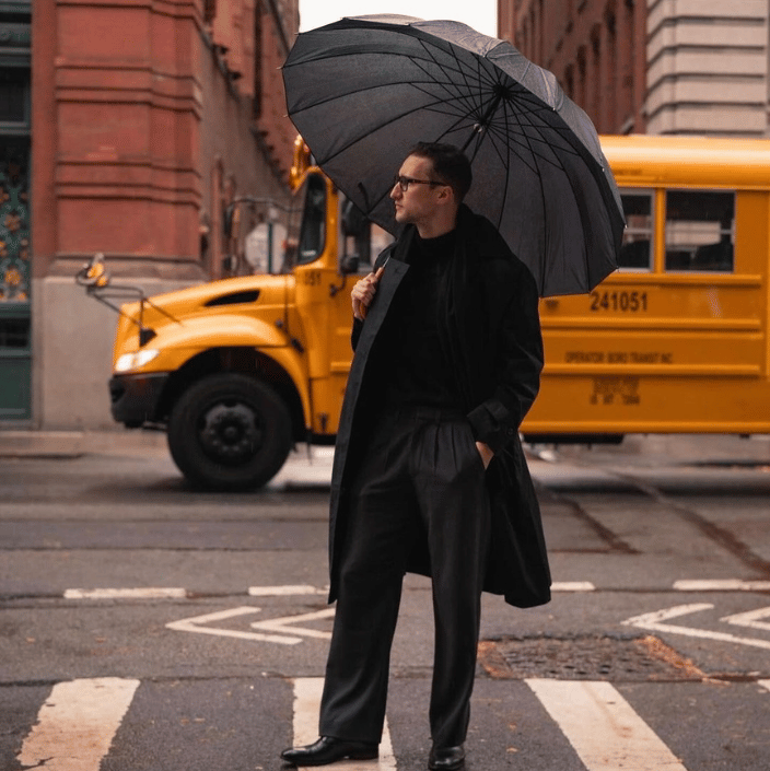Man with black umbrella