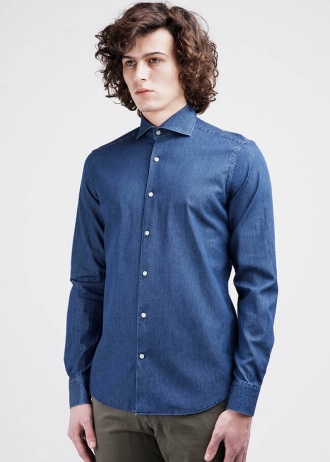 Man in a dark blue denim dress shirt