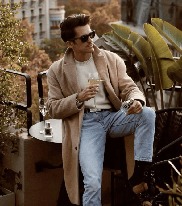 Men’s Fashion Magazine wearing a coat and sunglass