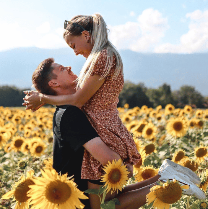 Couple on sunflower field
