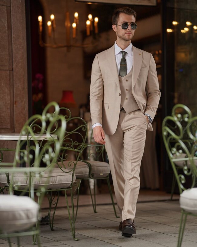 A sophisticated beige suit, perfect for formal events. 