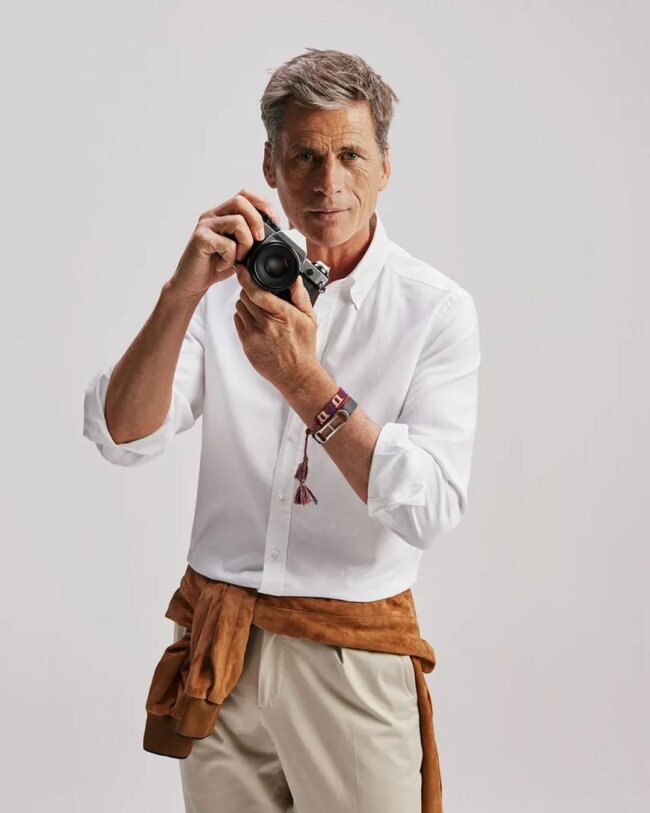 A plain button-down with chinos offer the perfect combo.