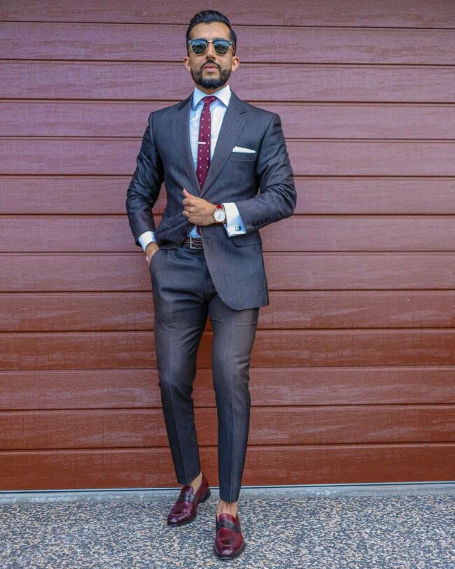 A stylish and refined charcoal gray suit. 