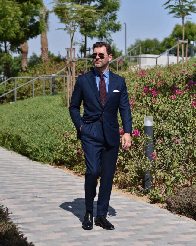 A cool summer outfit featuring a navy blue suit. 