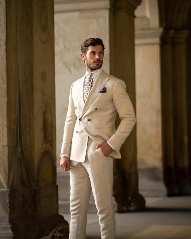 A classy cream suit offers a refined look for summer.