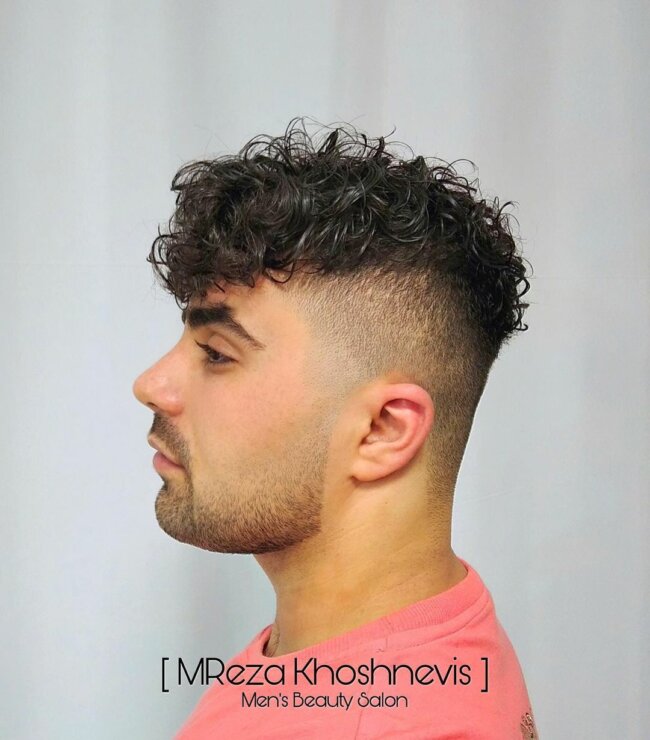 A modern and stylish look with curly fade hairstyle. 