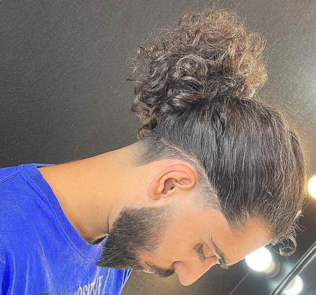 A sleek and unique curly ponytail undercut. 