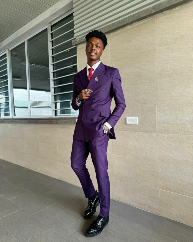 A bold look featuring a dark purple suit. 