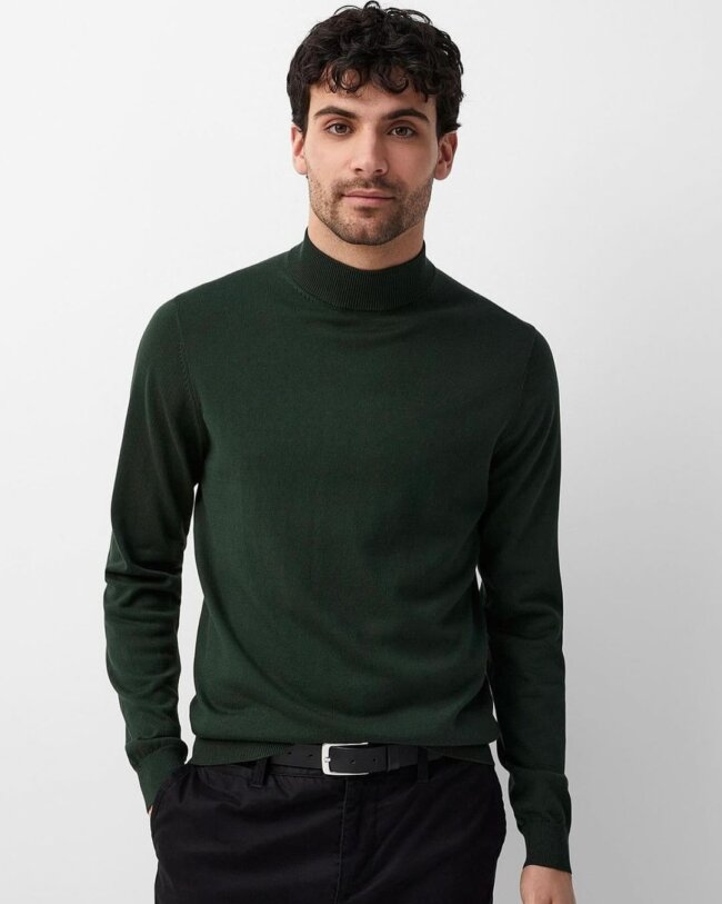 A cool outfit with a forest green turtleneck. 