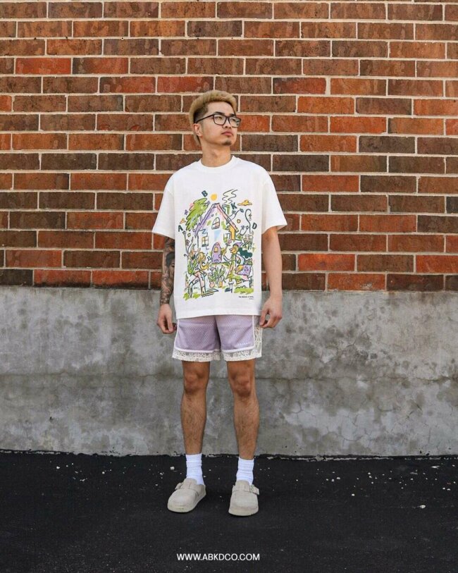 A trendy and cool appearance with graphic tee and shorts