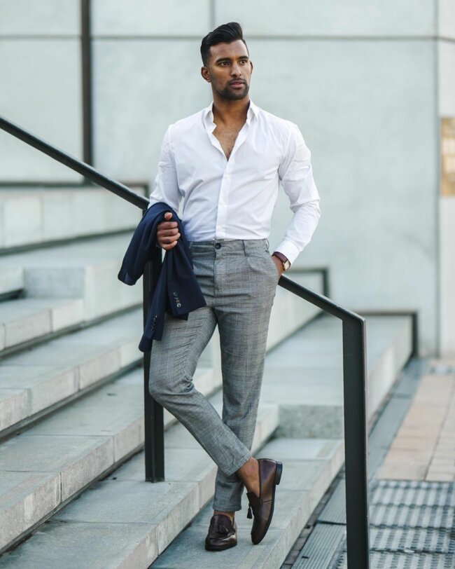 A sophisticated appearance with gray pants.