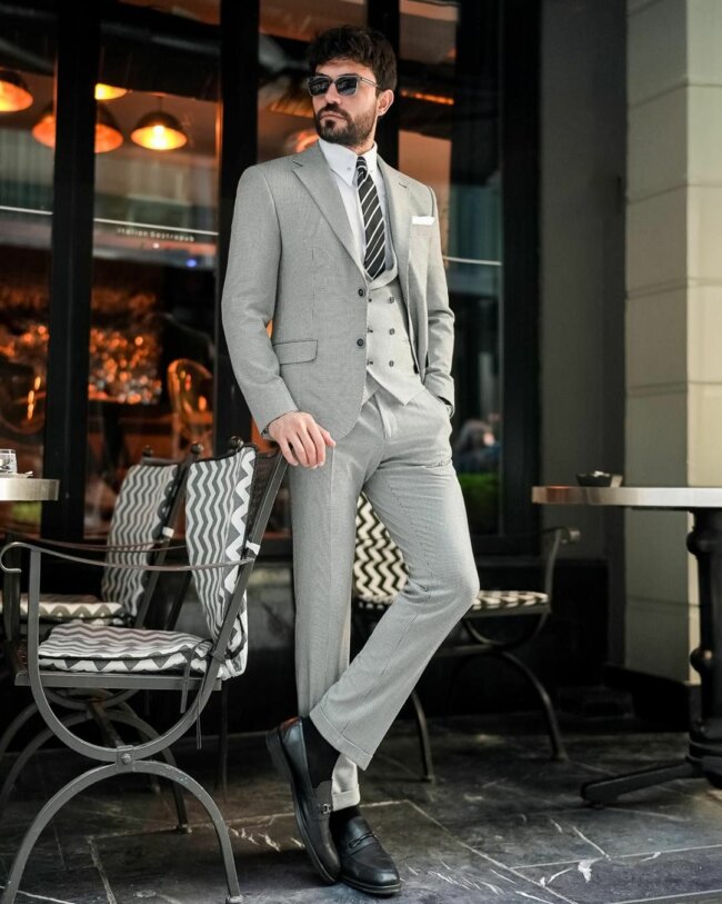 A sophisticated outfit with a houndstooth suit. 
