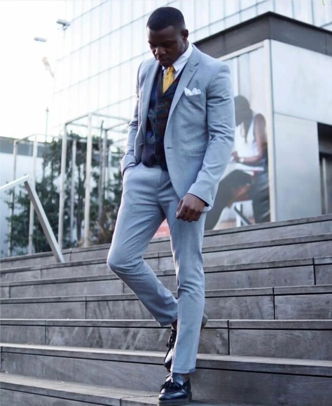 A classy light blue suit, offering a modest appearance.