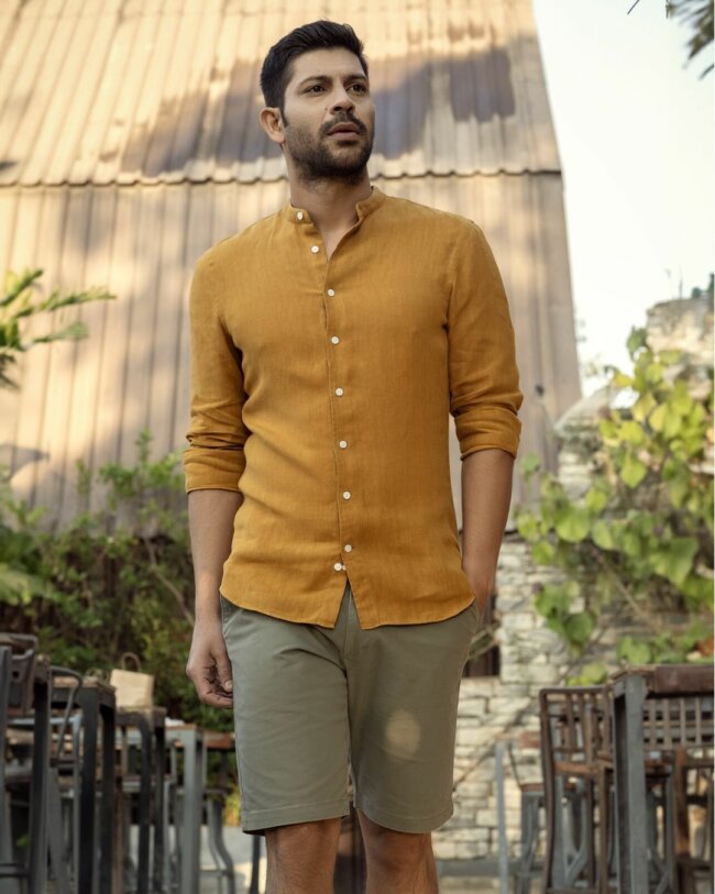 A classy linen shirt paired with shorts offer a chic look. 