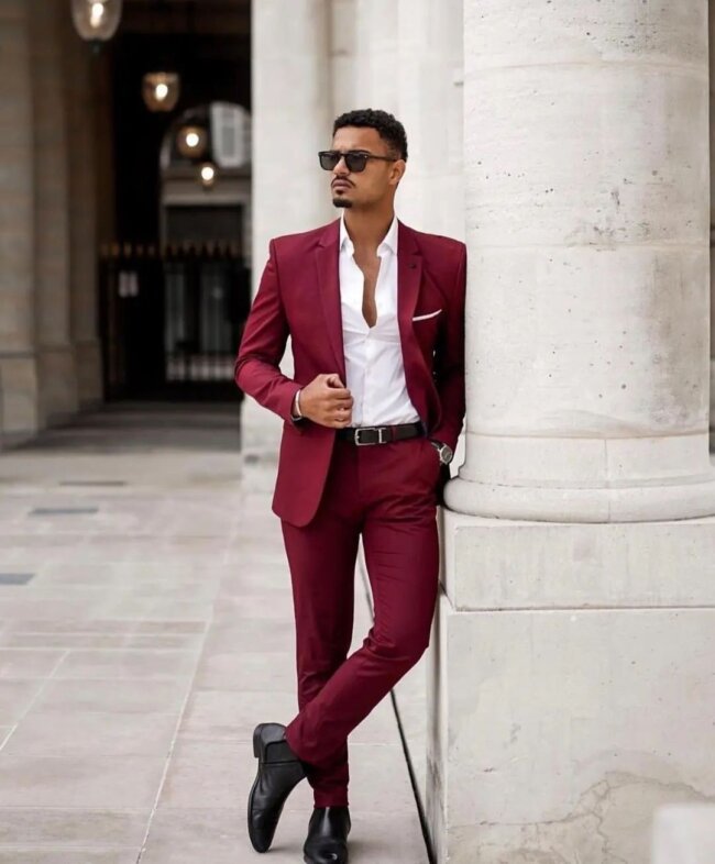 A chic outfit featuring a maroon suit. 
