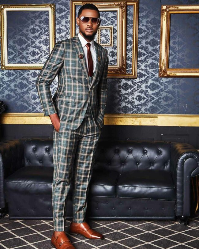 A unique and elegant look, featuring a patterned suit. 