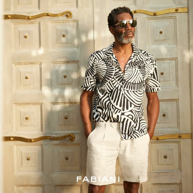 An exciting patterned button-down shirt with shorts offer an exclusive look for summer.