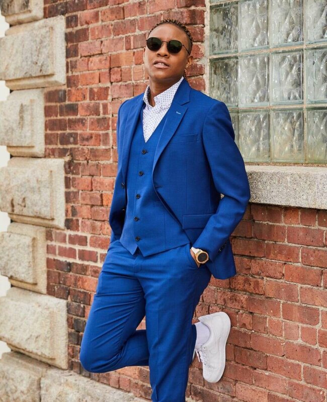 A stylish appearance with a royal blue suit. 