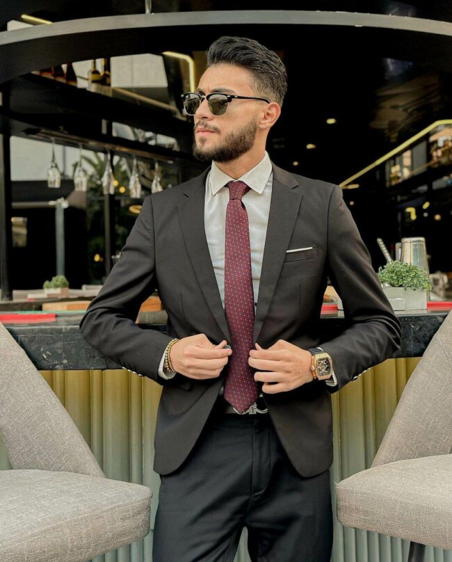 A silk necktie elevates the formal look. 