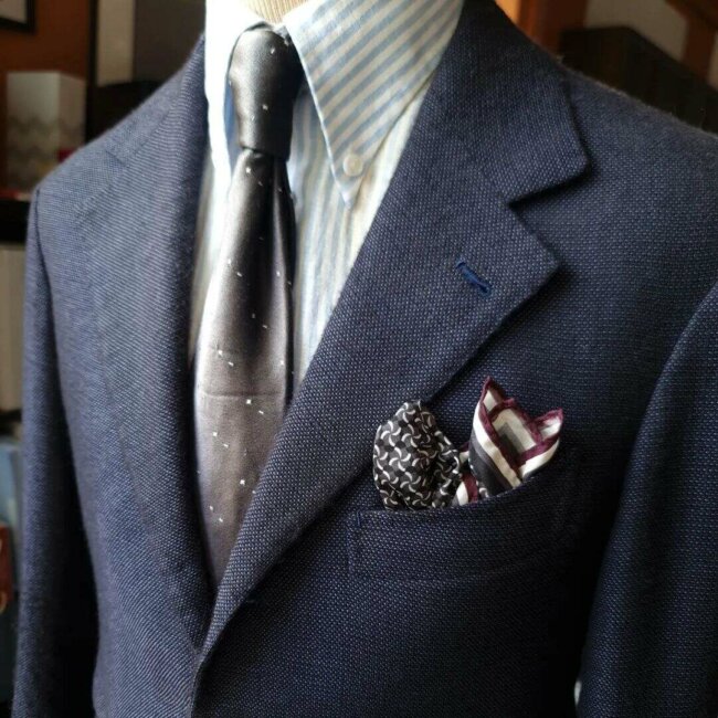 Silk pocket square elevating the appearance of the tailored suit.