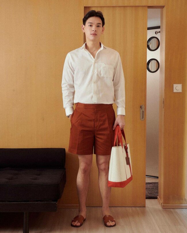 A semi-formal outfit featuring tailored shorts with a unique hue. 
