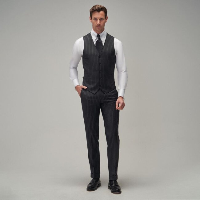 Tailored vest in it's fine form adds class to the whole look.