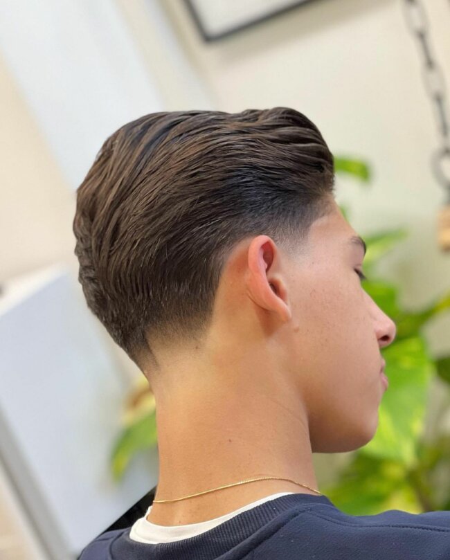 A classy and smooth look with a taper fade haircut. 