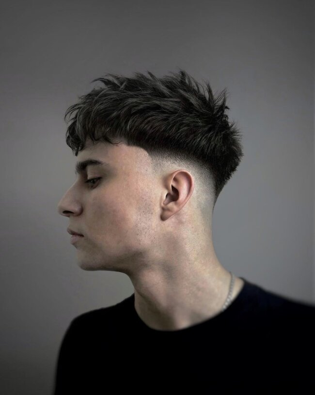 A unique appearance with a textured crop haircut. 