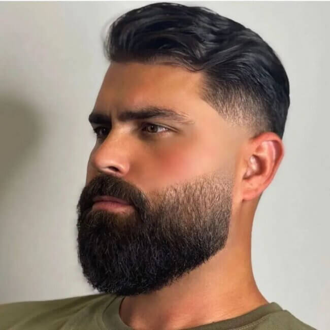 A smooth and high-class look with a tapered beard. 